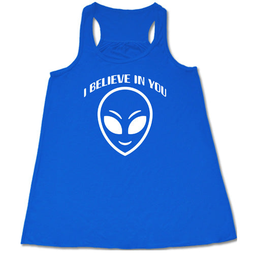 blue racerback tank top with a "I believe in you" quote and alien head design on it