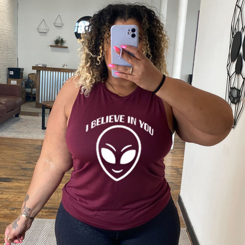 maroon muscle tank top with a "I believe in you" quote and alien head design on it