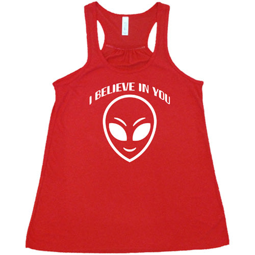 red racerback tank top with a "I believe in you" quote and alien head design on it