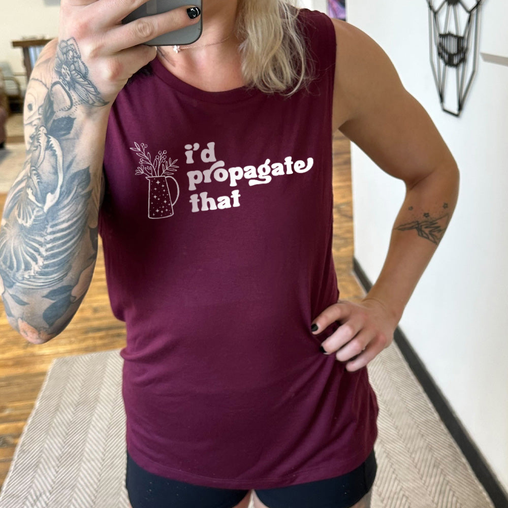 Model wearing maroon colored muscle tank with a pitcher of plants graphic on it that says "I'd Propagate That" 