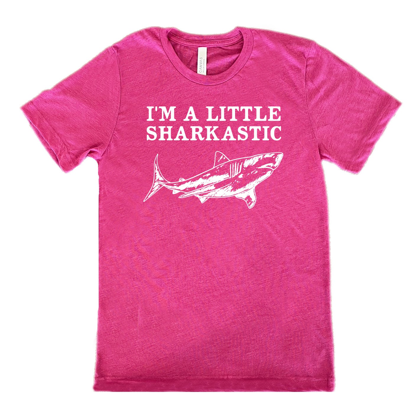 berry unisex tee with the words "I'm a little sharkastic" on it, over the graphic of a shark