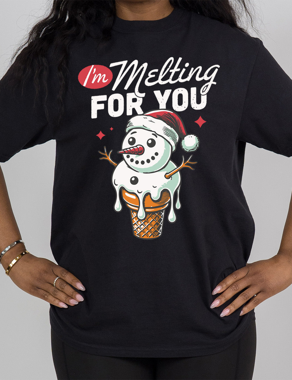 black modern tee with the graphic of a happy snowman's head and torso as the ice cream in a cone, dripping, wearing a Santa hat, with a couple stars, and the words above this saying "I'm Melting FOR YOU" with the "I'm" in a red oval