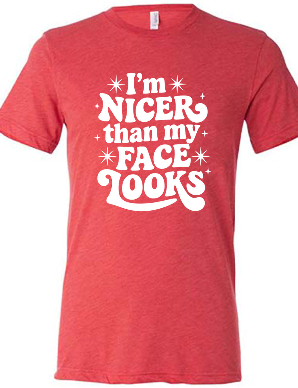 red unisex tee with the words "I'm nicer than my face looks" surrounded by stars