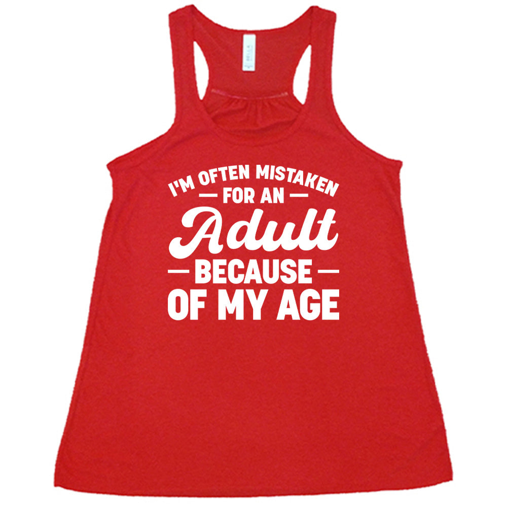 red flowy tank with the words "I'm often mistaken for an adult because of my age" on it