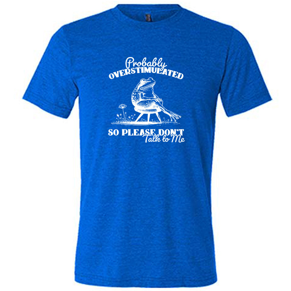 Blue colored shirt with a frog on a chair graphic on it that says "Probably Overstimulated So Please Don't Talk to Me" 