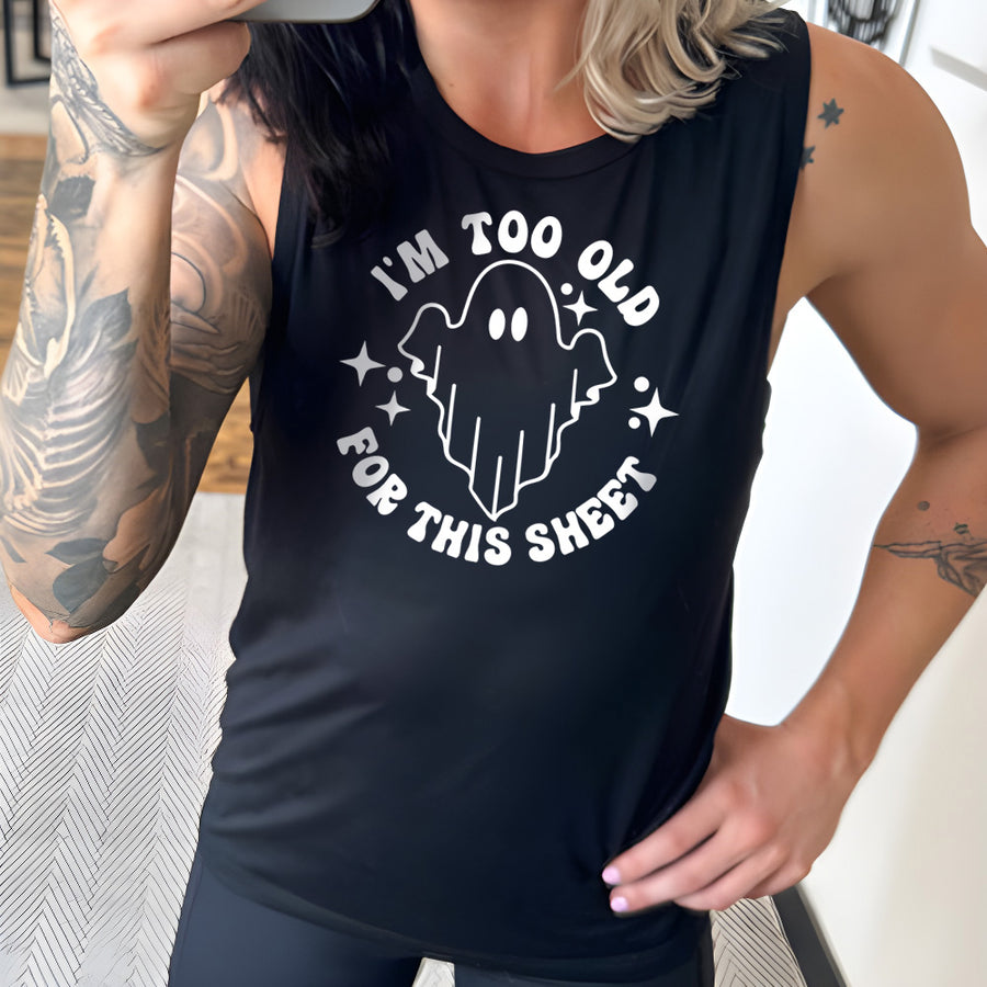 Model wearing black colored muscle tank with ghost graphic on it that says "I'm Too Old For This Sheet"