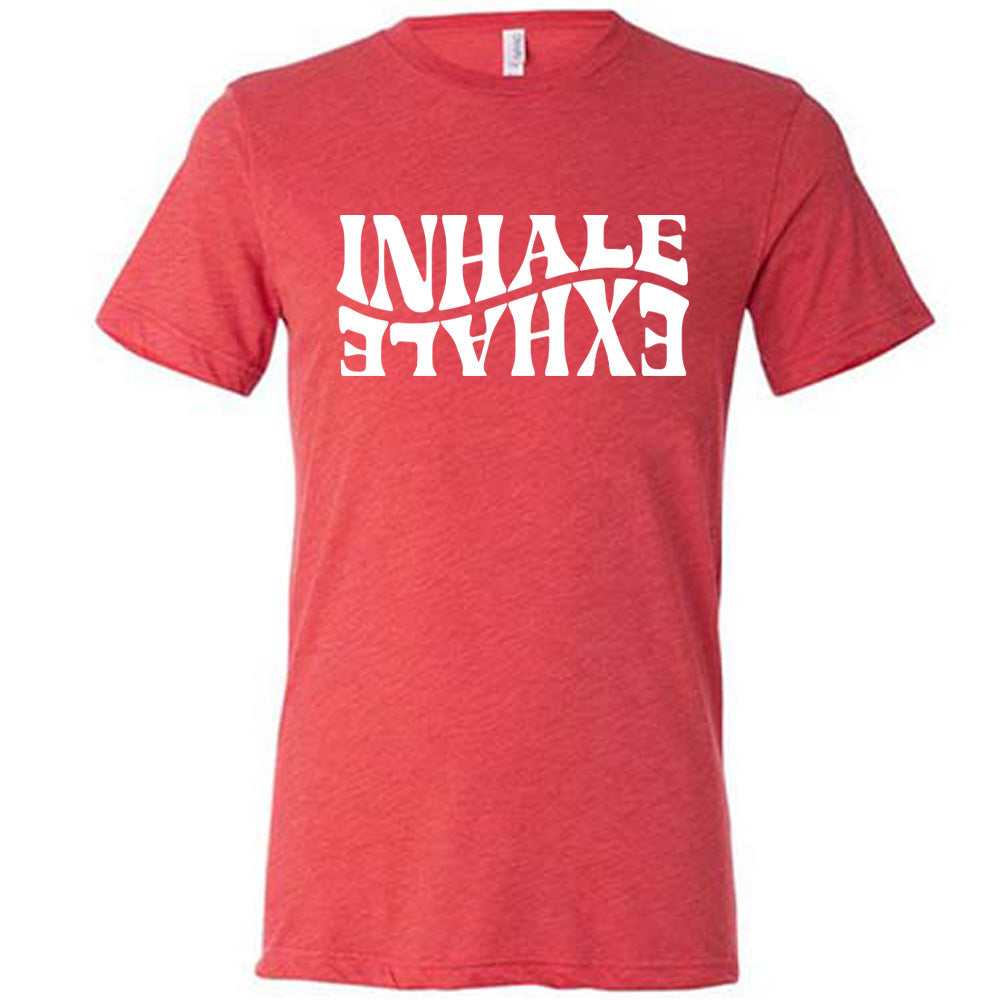 Red unisex tee with the words "inhale exhale" on it, with the word "exhale" upside down and backwards, giving almost a yin and yang effect
