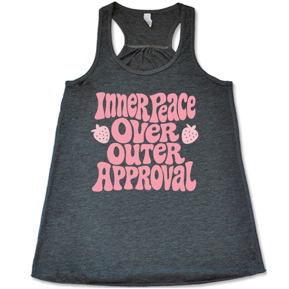 grey racerback tank with the words "inner peace over outer approval" on it, with two small strawberry graphics on either side of the word "over"
