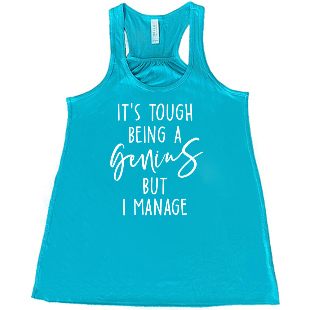 Teal colored flowy tank with graphic on it that says "It's Tough Being A Genius But I Manage" 