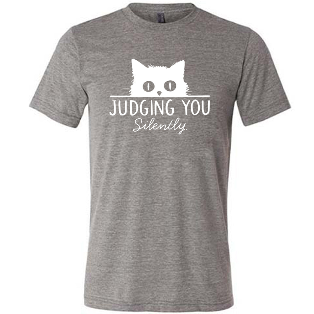 Grey colored shirt with cat graphic on it that says "Judging You Silently" 