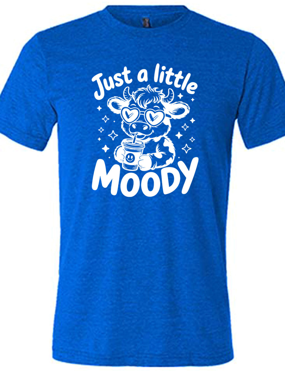 blue unisex tee with the graphic of a cartoon cow, wearing heart sunglasses and drinking out of an iced cup with a straw, surrounded by little stars, as well as the words "just a little moody" around it