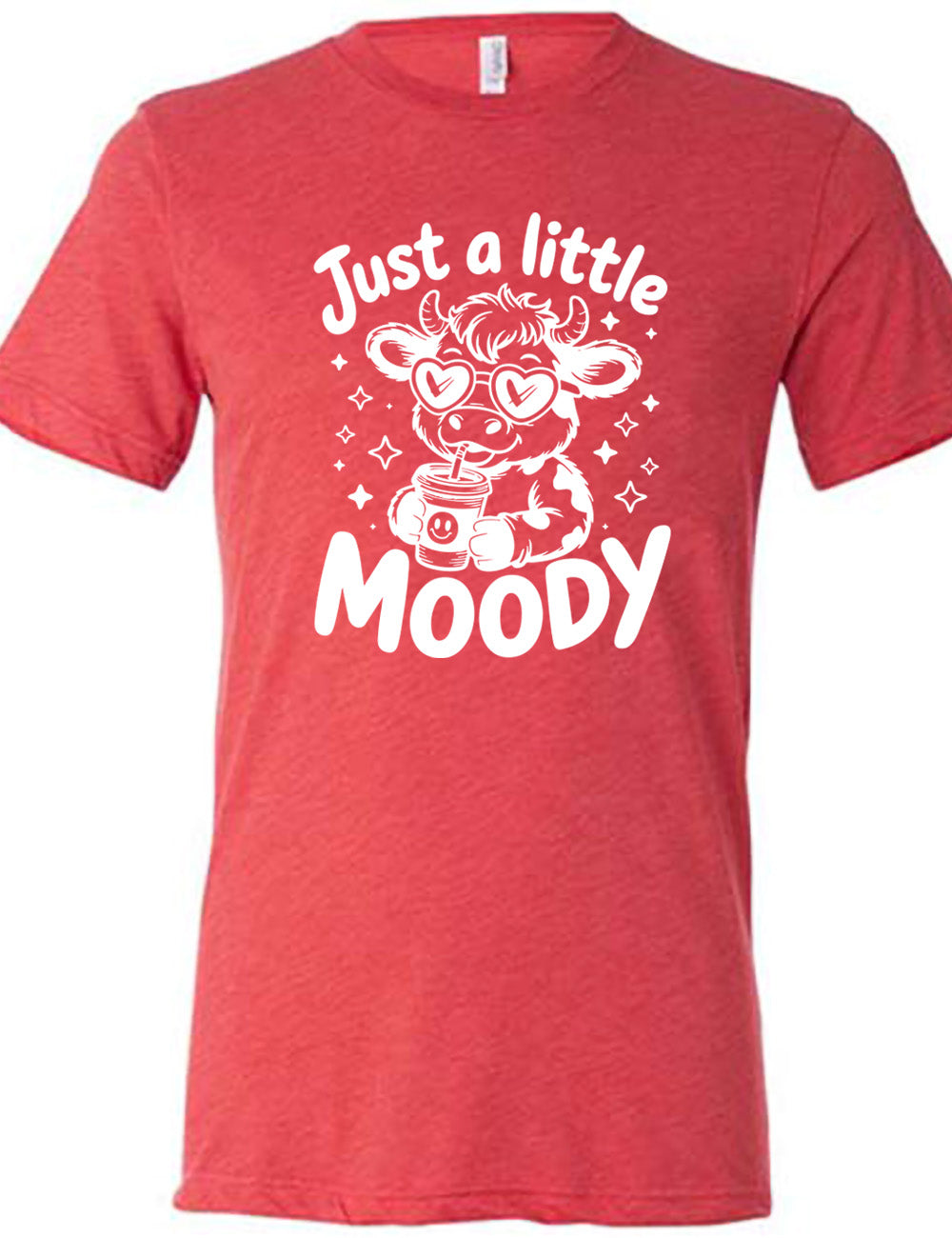 red unisex tee with the graphic of a cartoon cow, wearing heart sunglasses and drinking out of an iced cup with a straw, surrounded by little stars, as well as the words "just a little moody" around it