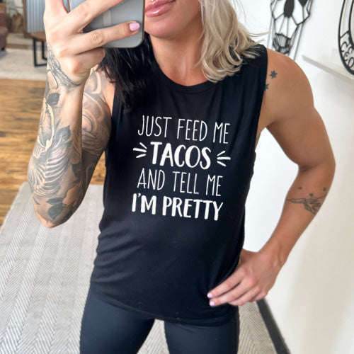 model wearing the black Just Feed Me Tacos And Tell Me I'm Pretty muscle tank