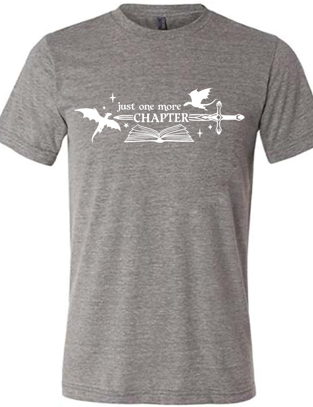 grey unisex tee with the graphic of an open book, with stars and a couple dragon silhouettes, and a sword, and the words "just one more chapter" on it, with the word "chapter" overlaying the sword