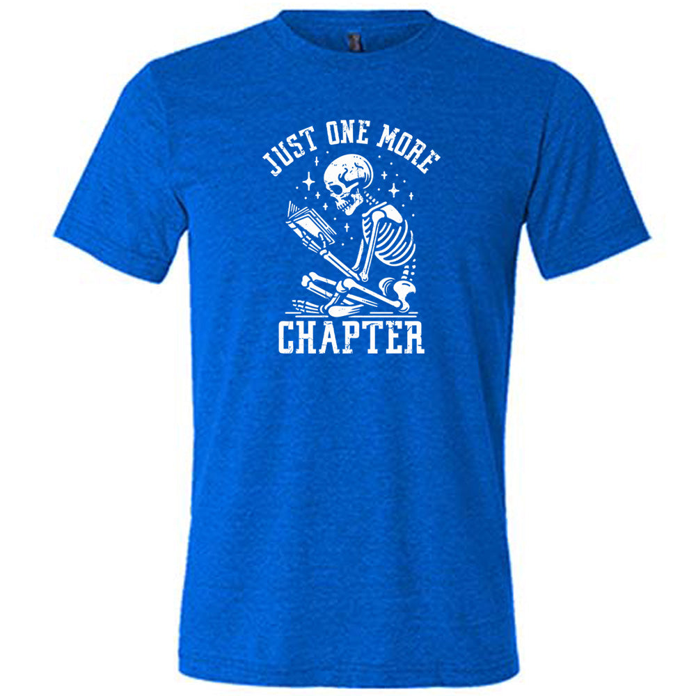 blue shirt with the text "Just One More Chapter" on it