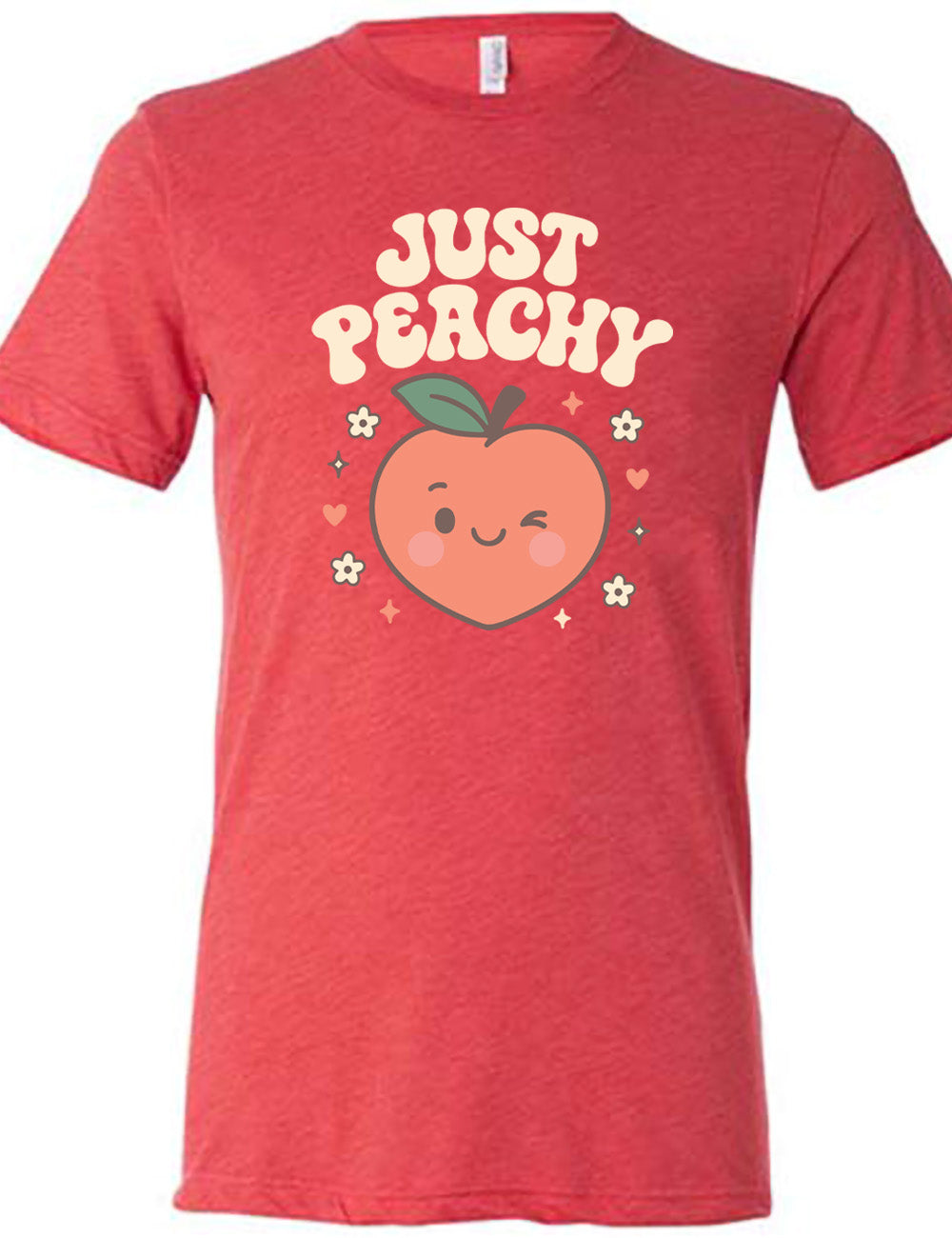 red unisex tee with the graphic of a winking peach, surrounded by little hearts, flowers, and stars, with the words above it saying "just peachy"