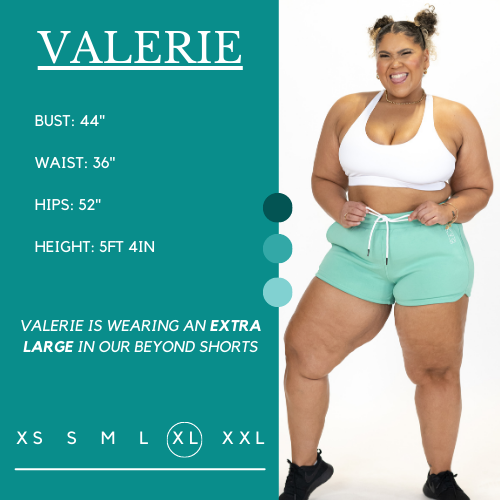 Model's measurements of 44 inch bust, 36 inch waist, 52 inch hips, and height of 5 foot 4 inches. She is wearing a size extra large in these shorts.