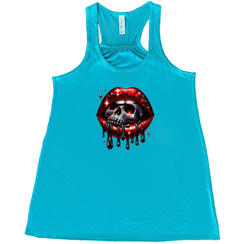 teal shirt with a skull and lip graphic on it