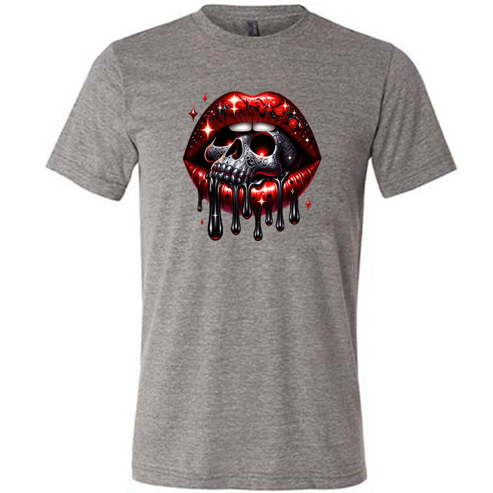 grey shirt with a skull and lip graphic on it