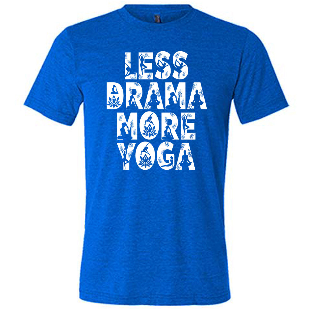 blue unisex tee with the words "less drama more yoga" on it, and within each letter there are silhouettes of people doing yoga poses as well as some lotus flowers and some leaves