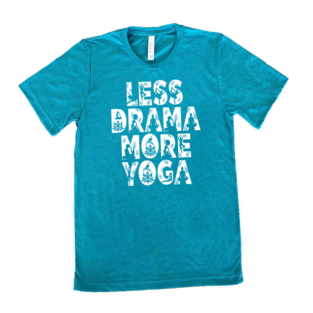 teal unisex tee with the words "less drama more yoga" on it, and within each letter there are silhouettes of people doing yoga poses as well as some lotus flowers and some leaves