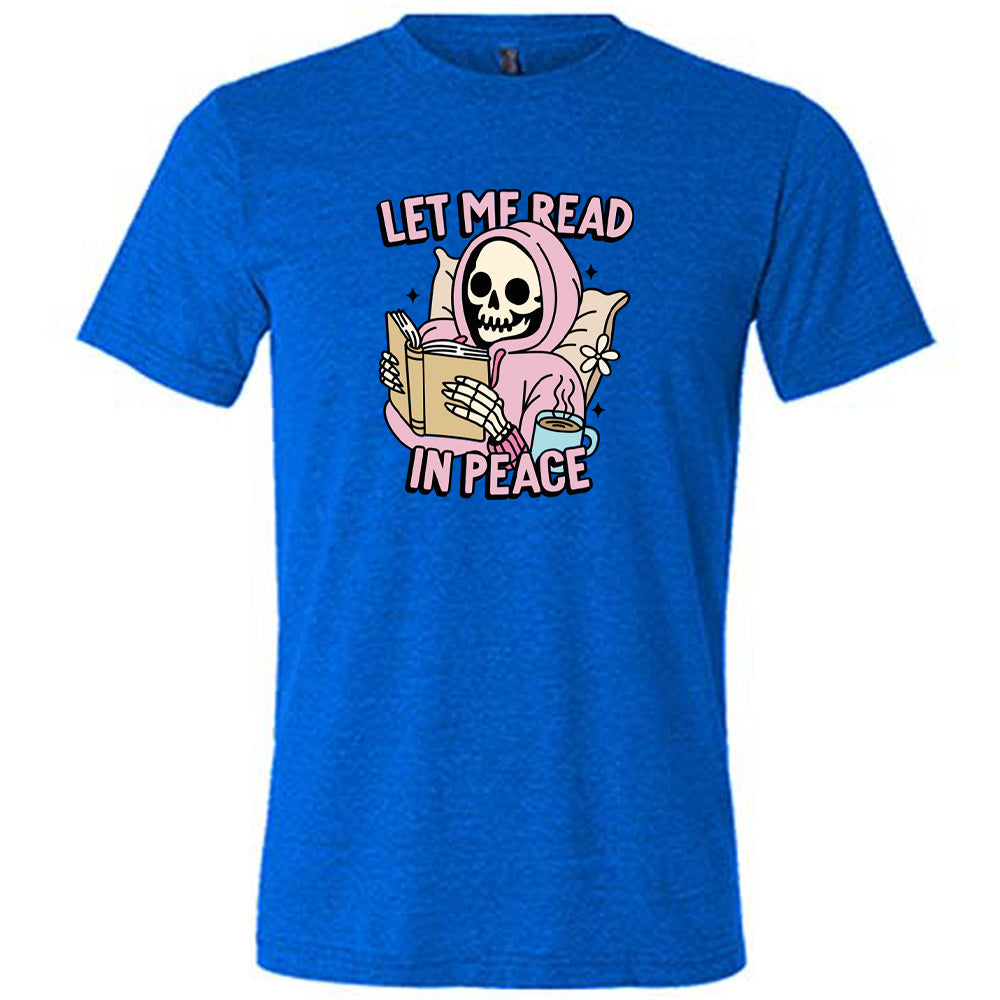 blue shirt with the text "Let Me Read In Peace" and a skeleton reading graphic on it