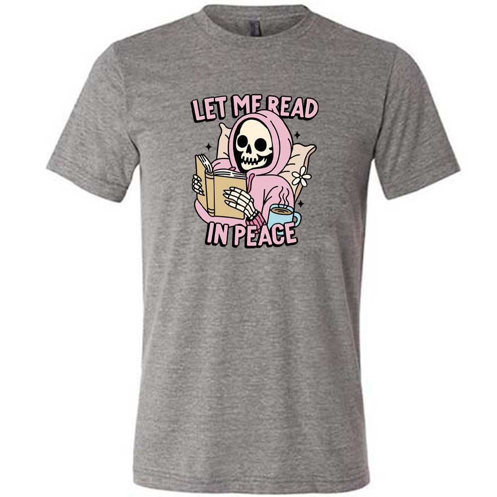 grey shirt with the text "Let Me Read In Peace" and a skeleton reading graphic on it 