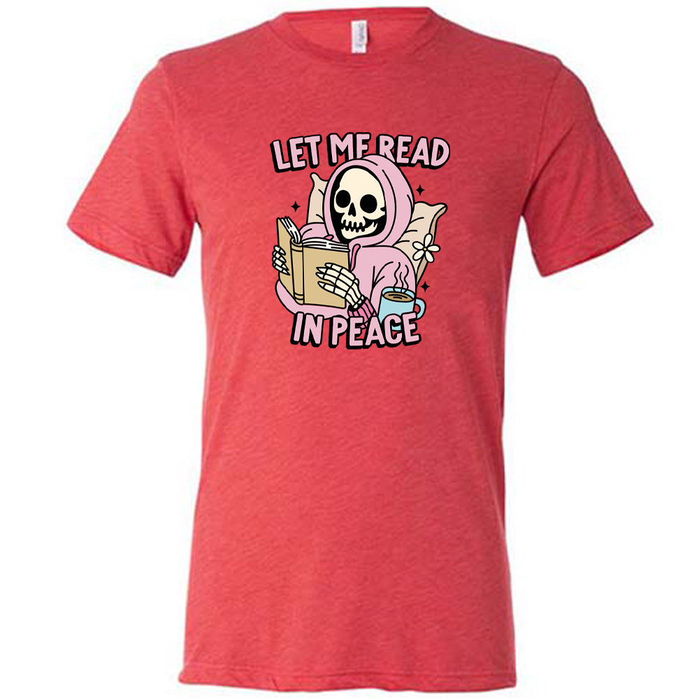 red shirt with the text "Let Me Read In Peace" and a skeleton reading graphic on it