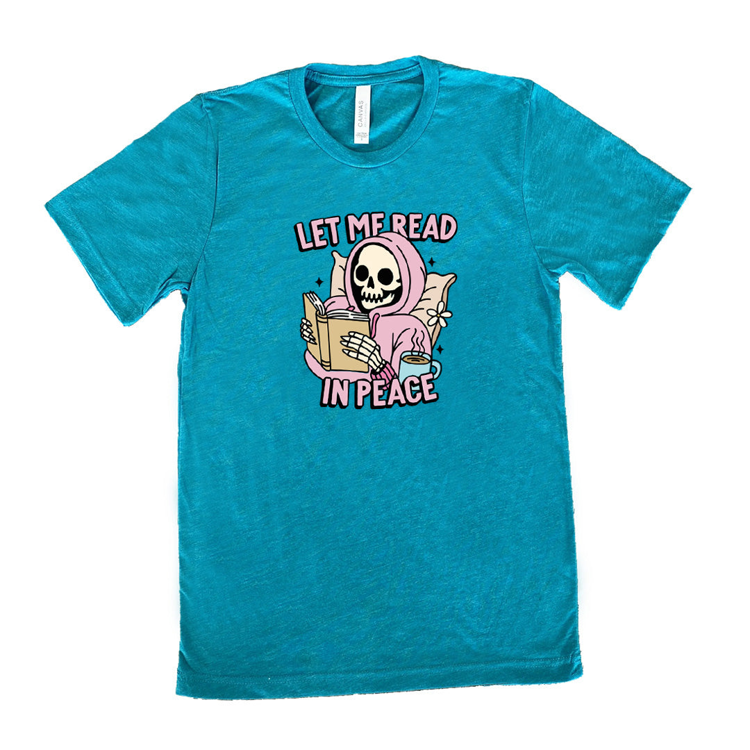teal shirt with the text "Let Me Read In Peace" and a skeleton reading graphic on it