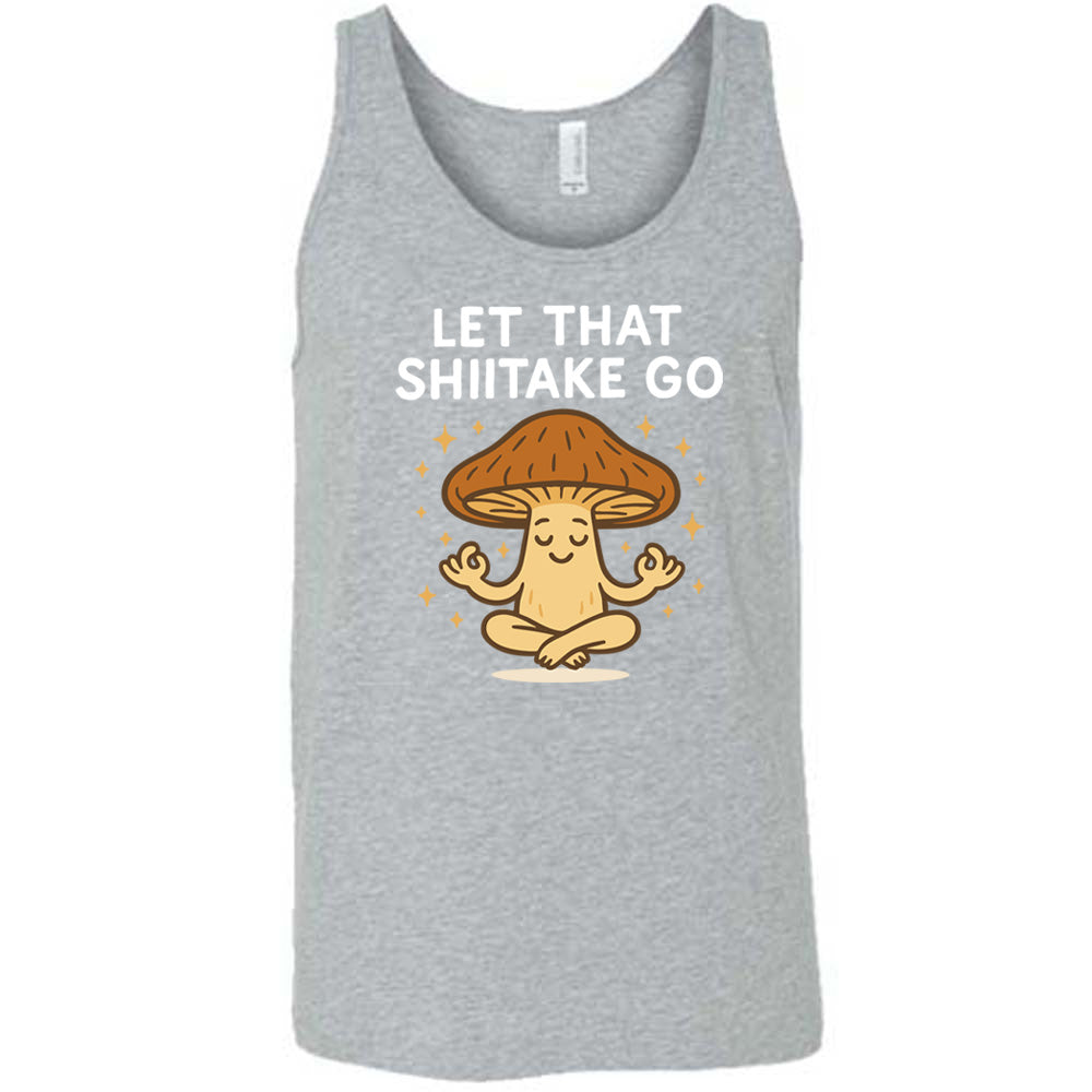 grey unisex tank with the words "let that shiitake go" on it and the graphic of a mushroom doing a yoga pose, surrounded by little stars