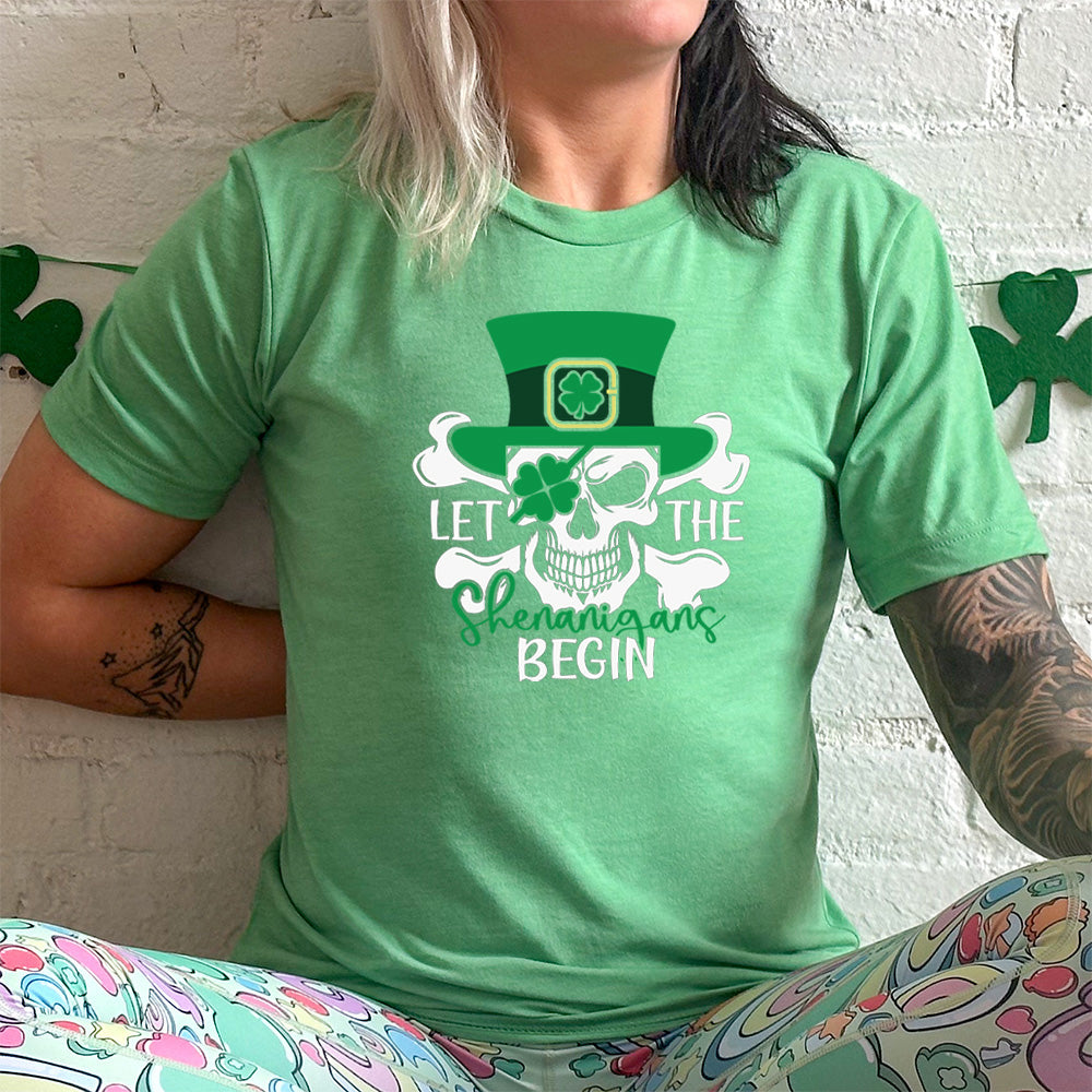 green shirt with the quote "Let The Shenanigans Begin" on it