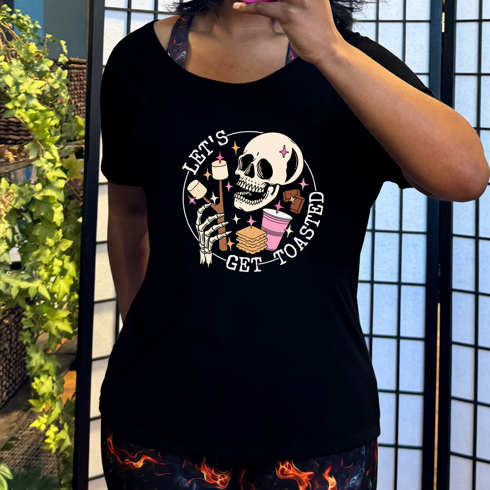 Black colored shirt with a skull and marshmallow stick graphic on it that says "Let's Get Toasted" 