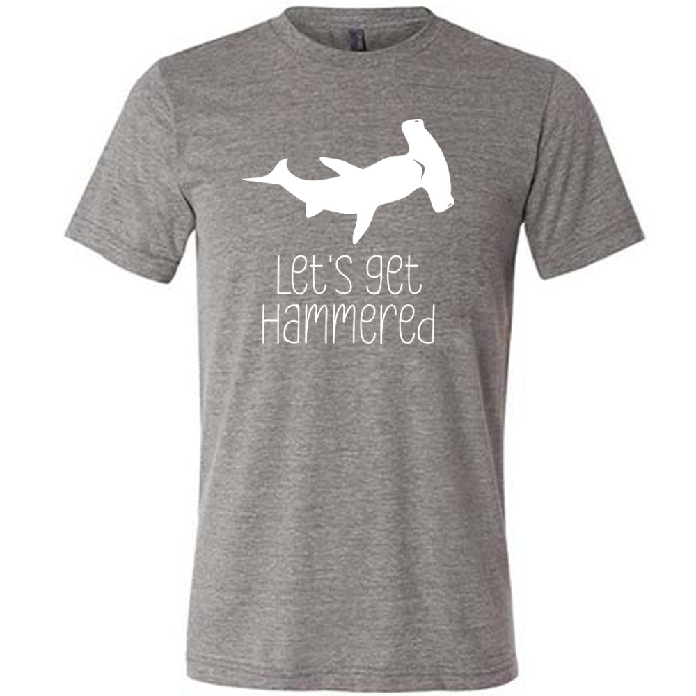 Grey colored shirt with a Hammerhead shark graphic on it that says "Lets Get Hammered" 
