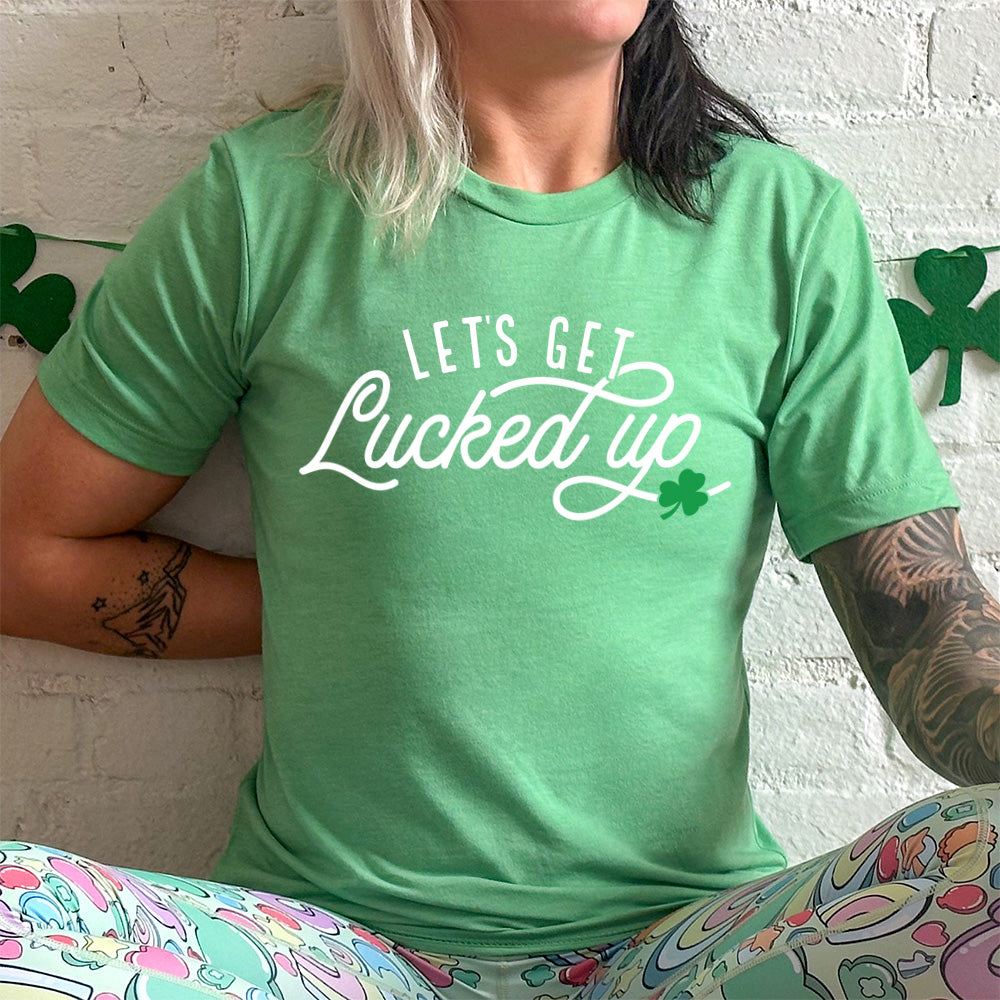 lucky green unisex tee with the words "let's get lucked up" on it with the graphic of a small shamrock