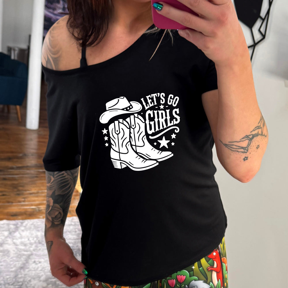 black slouchy shirt with a cowgirl boot and hat graphic on it that says "Let's Go Girls"