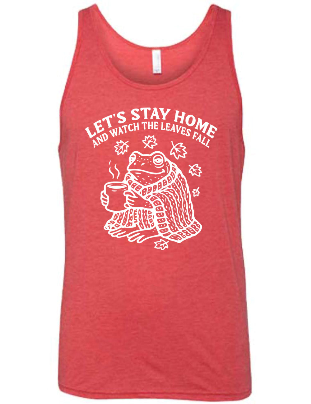 red unisex tank with the words "let's stay home and watch the  leaves fall" on it, and the graphic underneath of a frog, wrapped in a blanket, holding a mug of steaming beverage, with five leaves arching over it