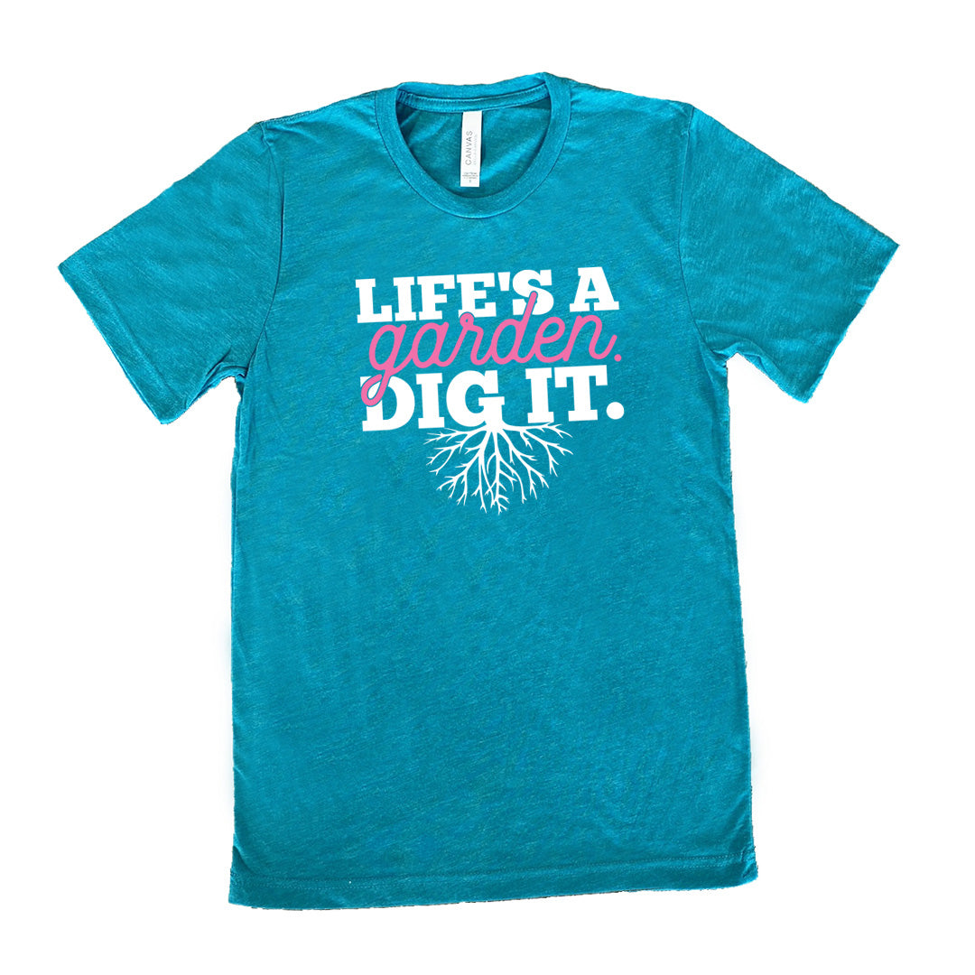teal unisex tee with the words "Life's a garden. Dig it." on it, with the "g" having roots growing down out the bottom of it