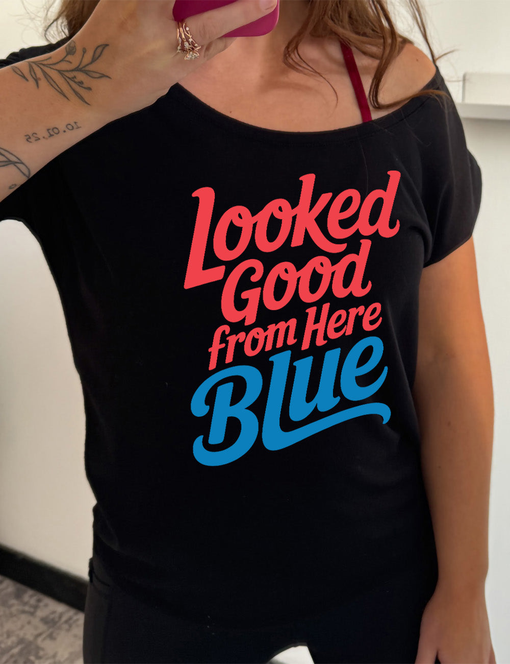 black slouchy tee with the words "looked good from here blue" on it
