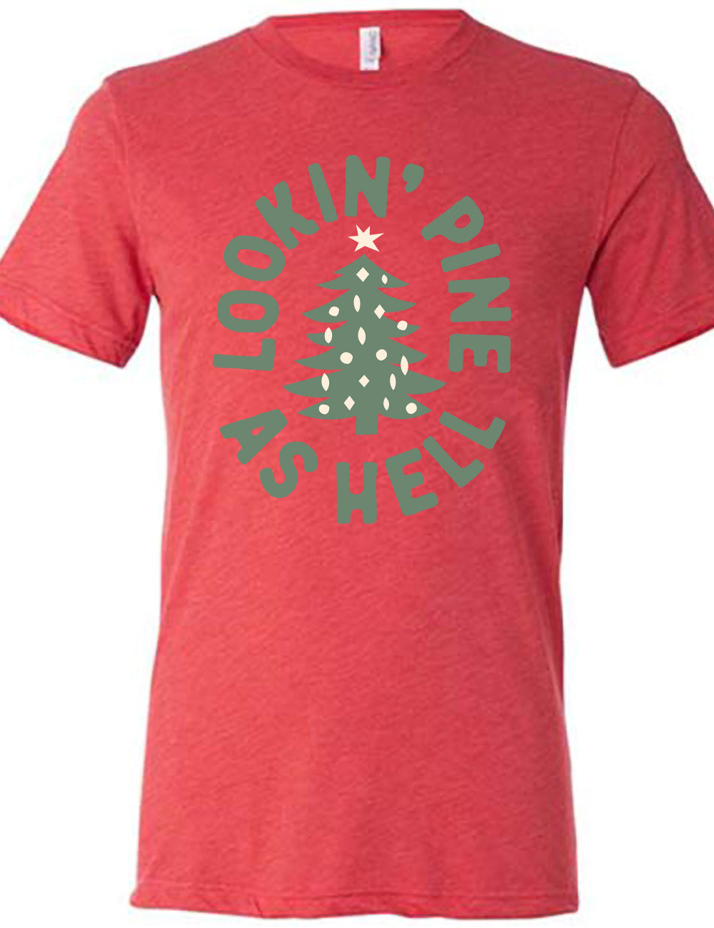red unisex tee with the graphic of a Christmas tree, surrounded in oval shape by words saying "lookin' pine as hell" in capital letters