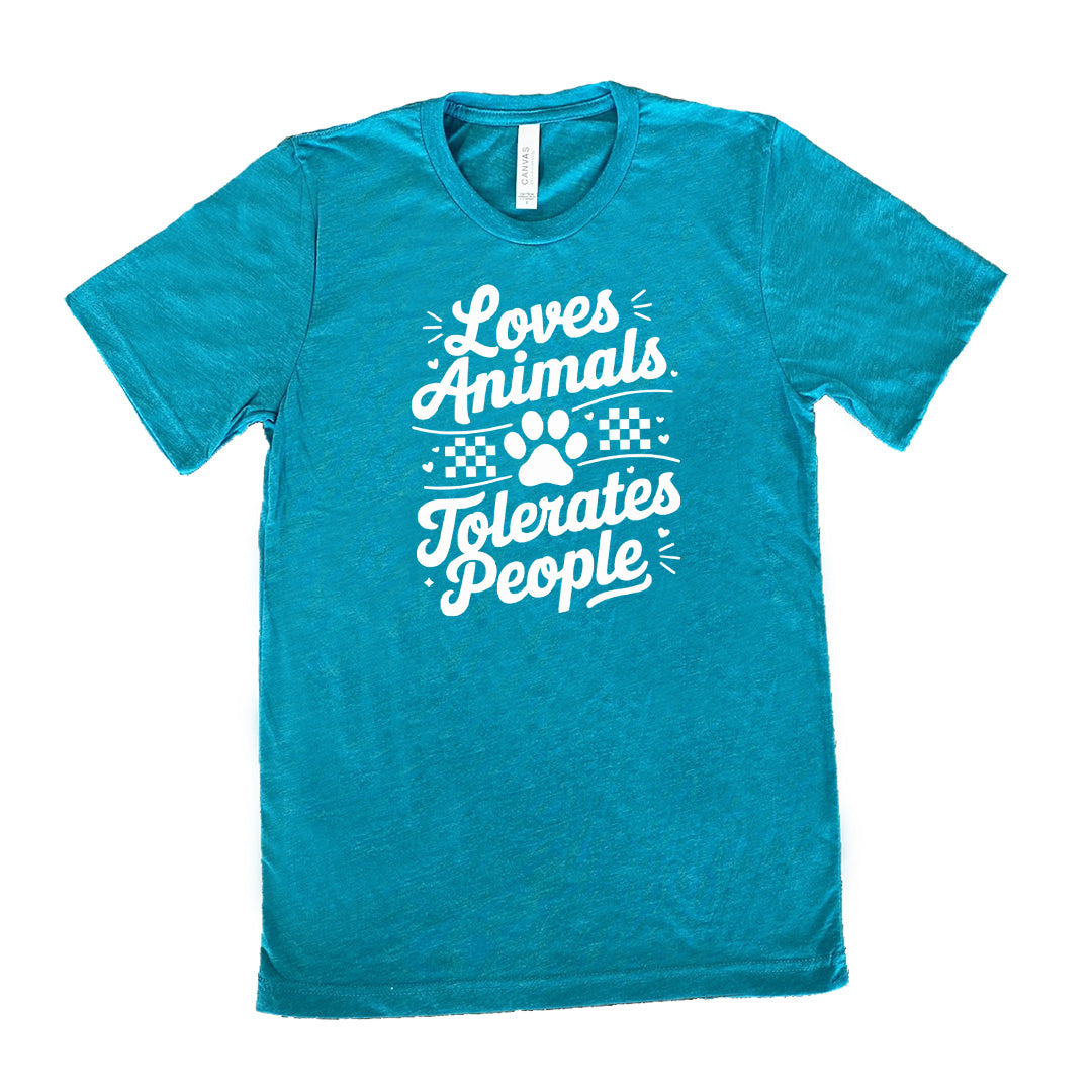 Teal colored shirt with paw print and whickers graphic on it that says "Loves Animals Tolerates People"