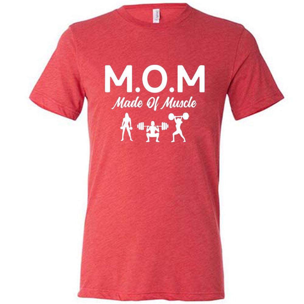 red unisex tee with the word "mom" in large letters as an acronym for the smaller words below it saying "made of muscle", and the graphic of three female silhouettes holding weights