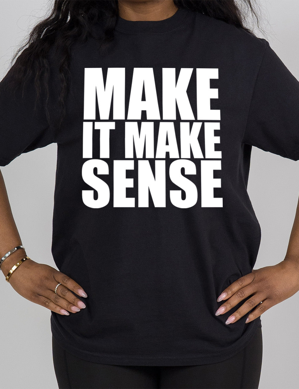 black modern tee with the words on it saying "make it make sense"