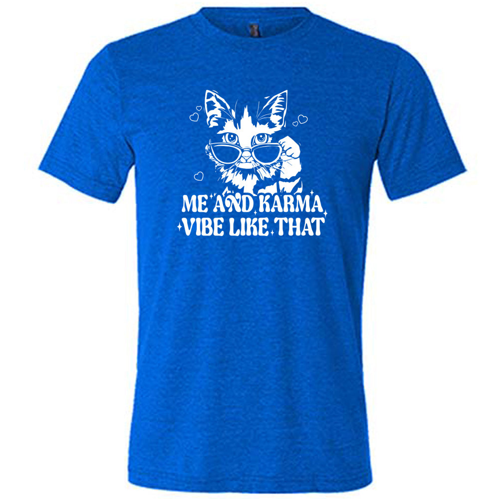 Blue colored shirt with a cat wearing sunglasses graphic on it that says "Me and Karma Vibe Like That" 