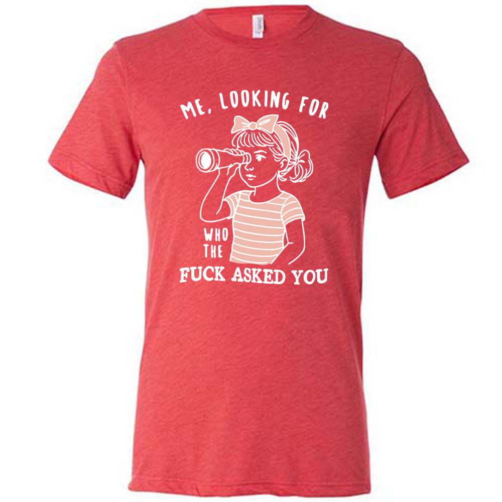 red unisex tee with the graphic of a young girl, wearing a striped pink shirt and a pink bowed headband and looking through a telescope, and the words "me, looking for who the fuck asked you" on it