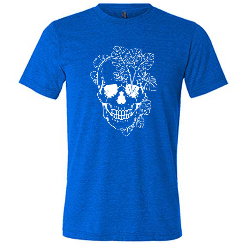 Blue colored shirt with a monstera plant and skull graphic on it
