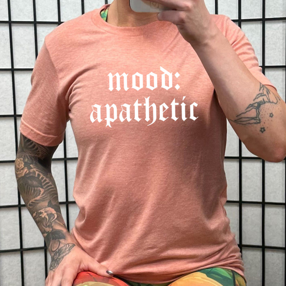 peach shirt with the text "Mood: Apathetic" on it