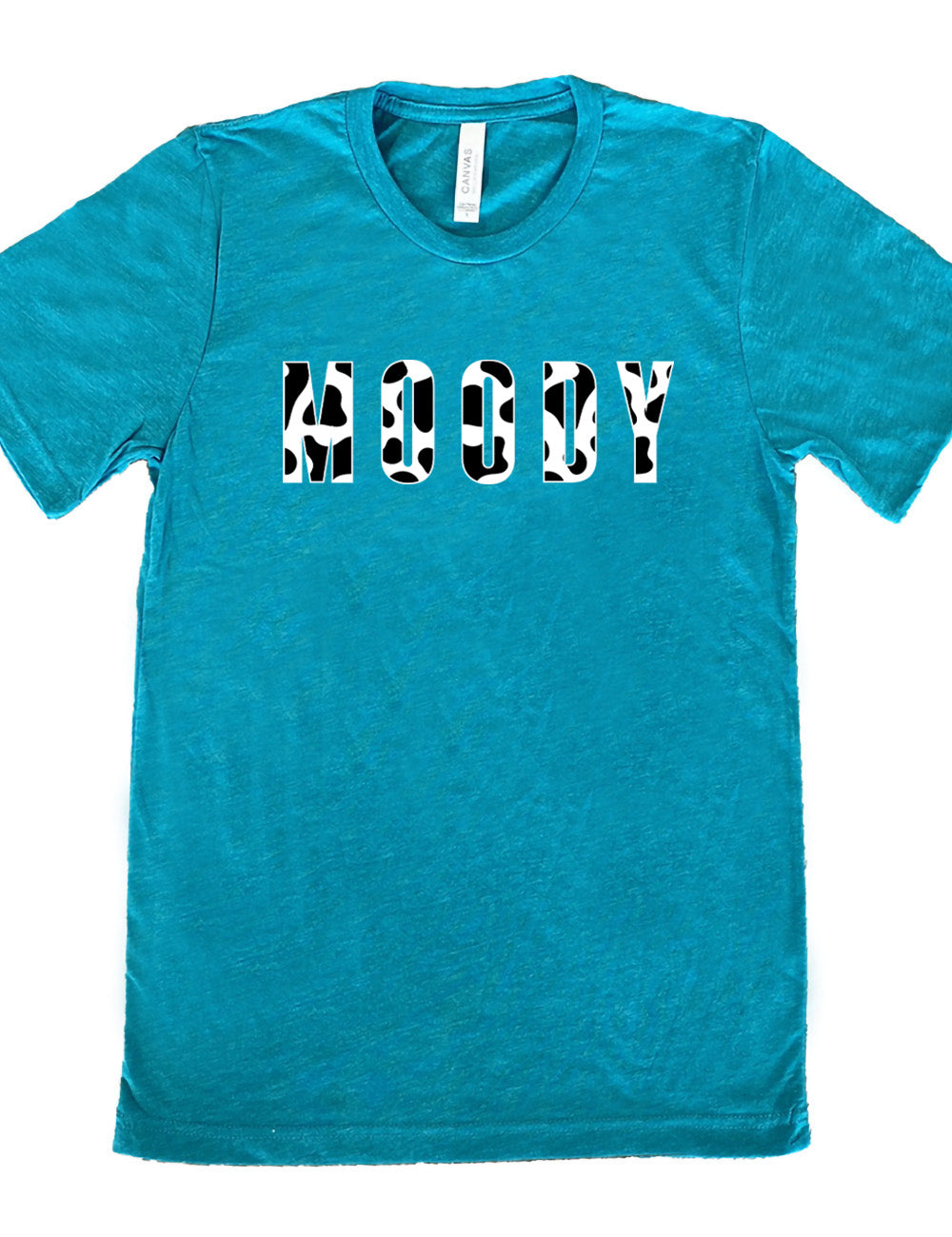 teal unisex tee with the word "moody" in all caps on it, with the font being cow print