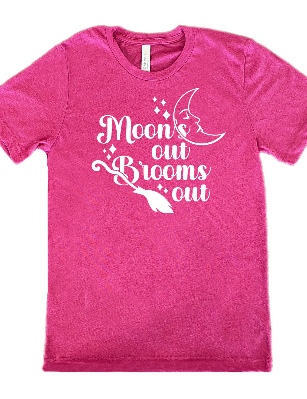 berry unisex tee with the words "moon's out brooms out" on it, with the line graphic of a crescent moon, with a sleeping face, and the graphic of a broom, and a few scattered stars