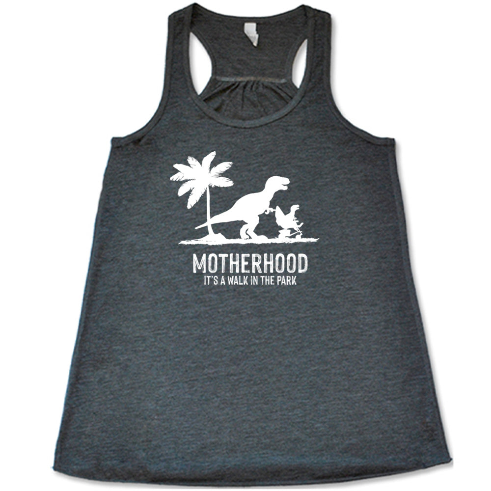 Grey colored flowy tank with a mother and child dinosaur graphic on it that says "Motherhood, Its a Walk in the Park" 