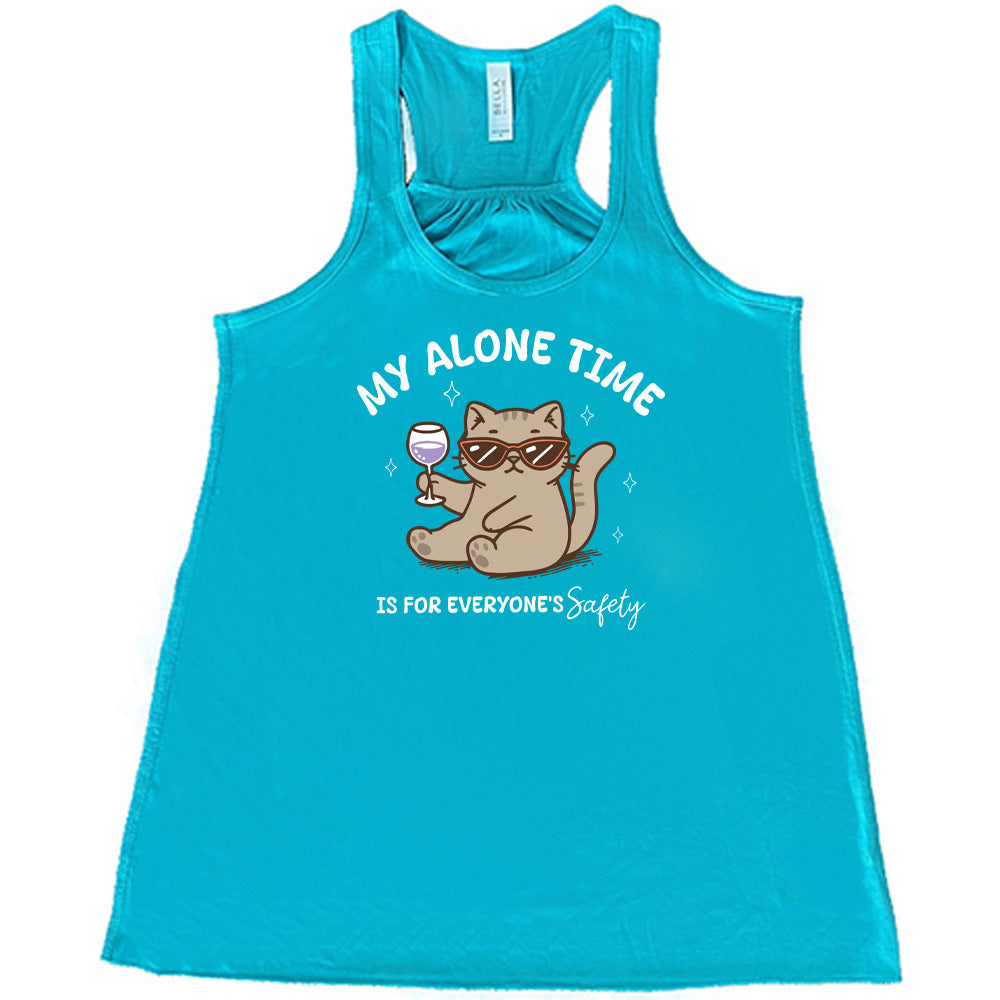 Teal colored flowy tank with a cat holding a wine glass graphic on it that says "My Alone Time Is For Everyone's Safety" 